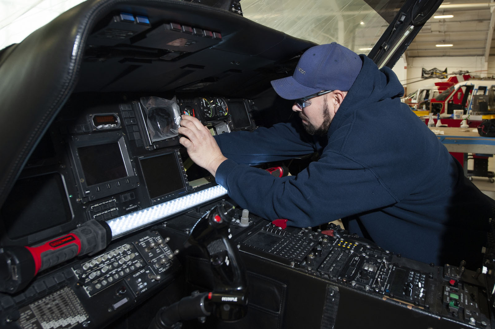 Summit Aviation technician performs maintenance on a Sikorsky helicopter.